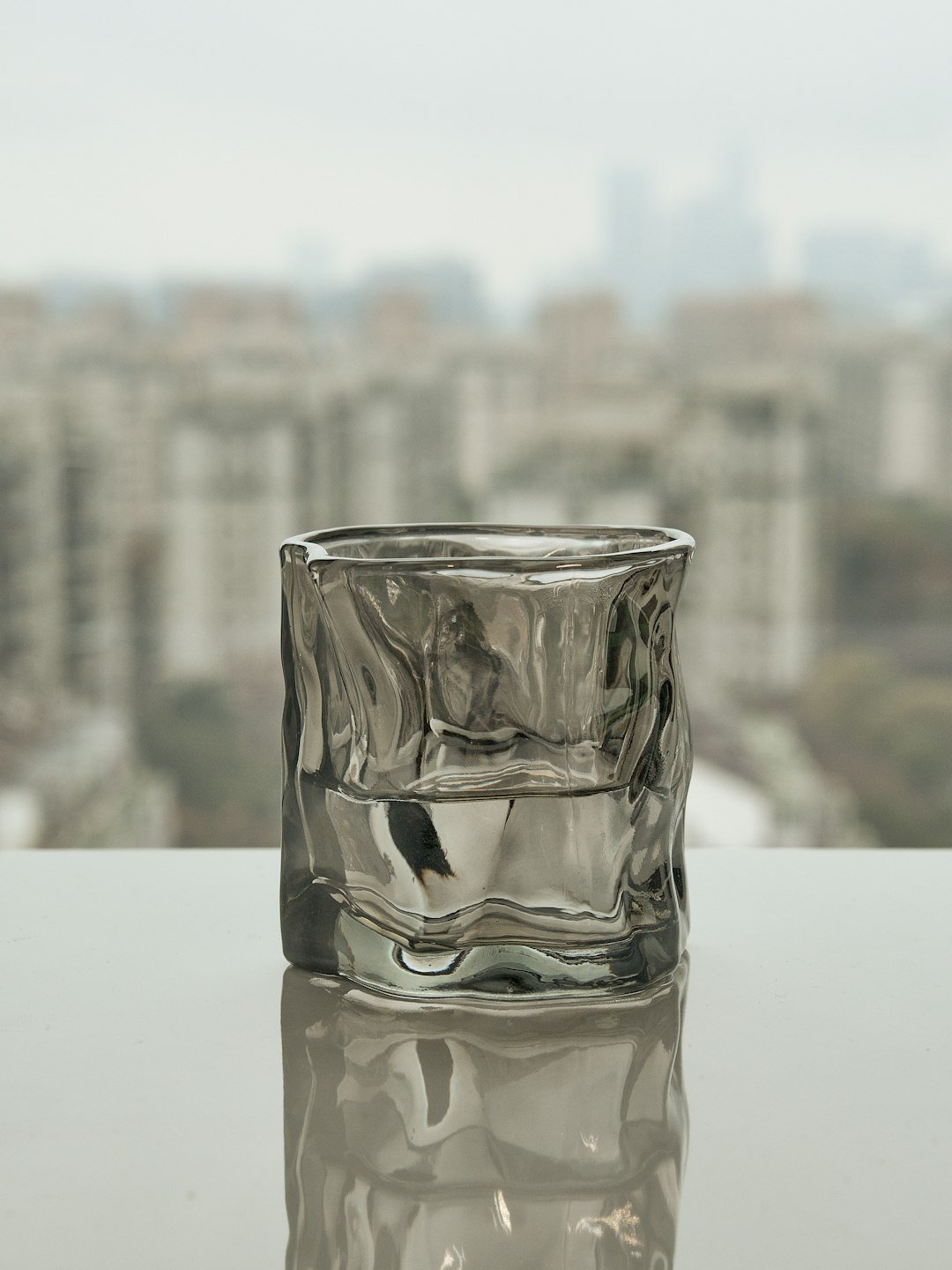 a glass of water sitting on top of a table