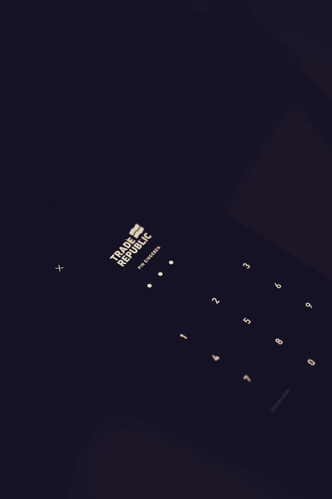 black qwerty phone on black textile