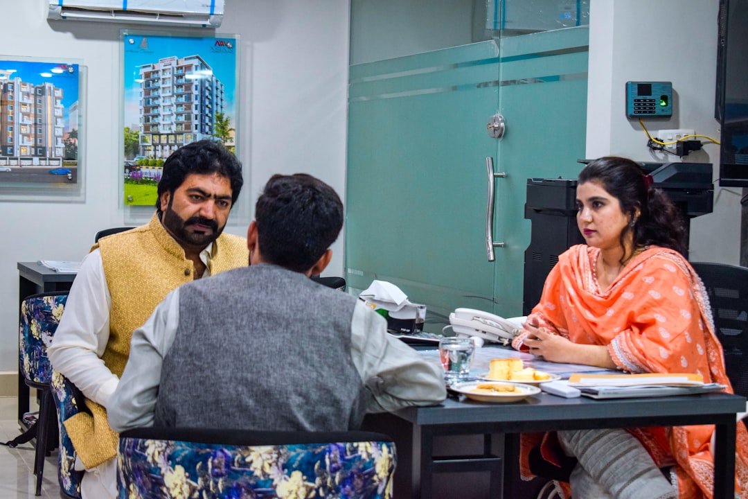 a group of people sitting around a table