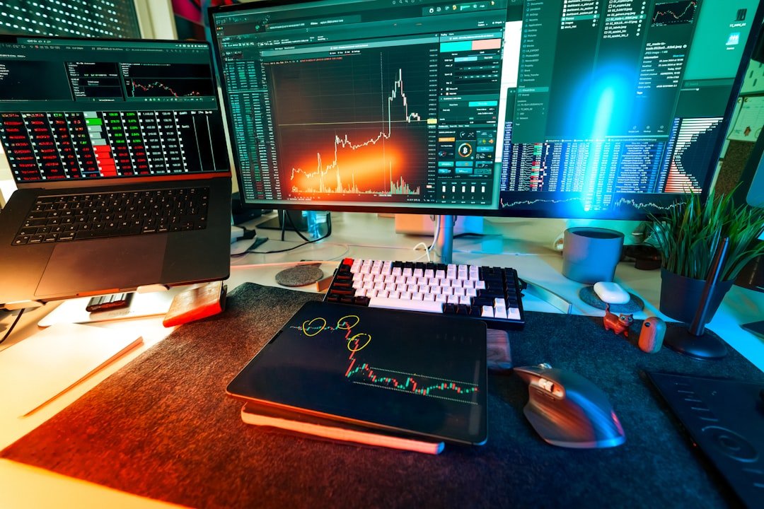 A trader's desk is lit up with charts.