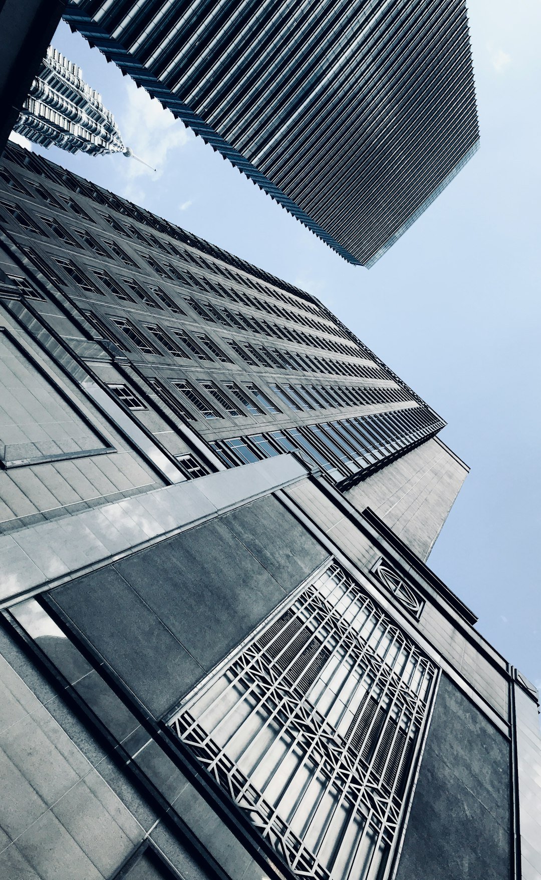looking up at tall buildings in a city