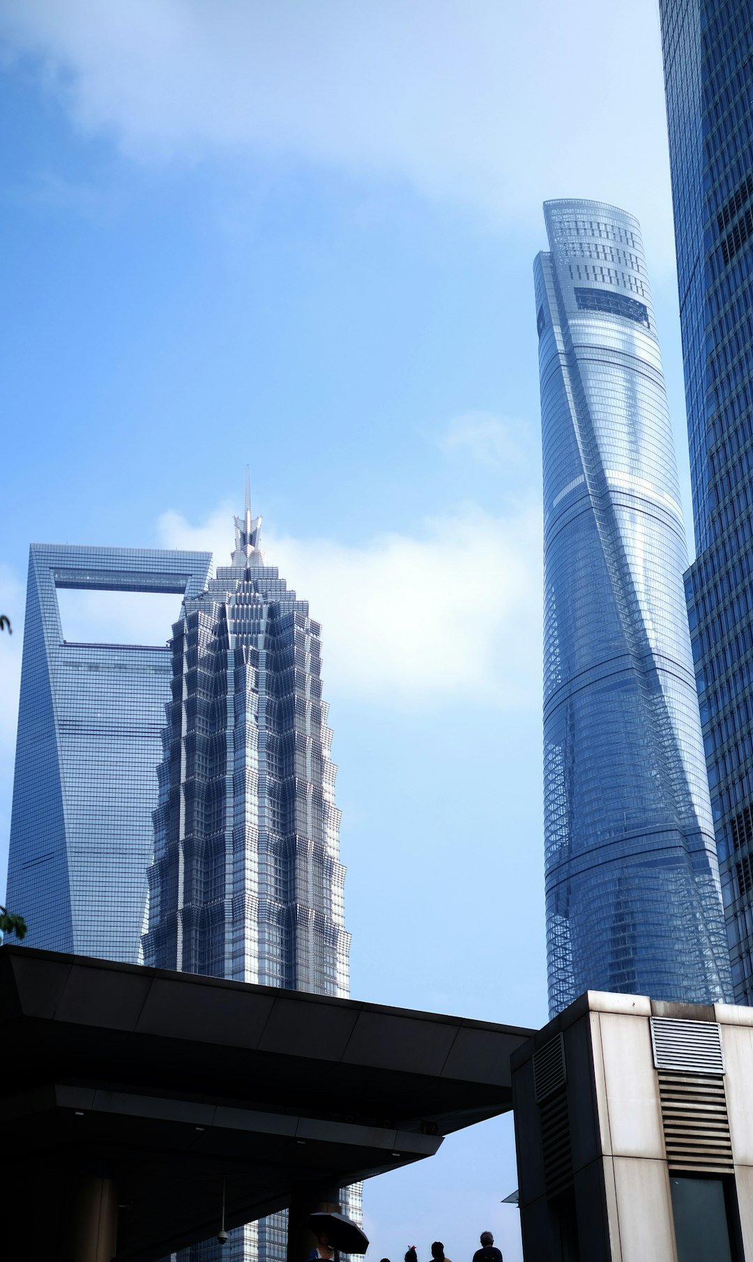 Modern skyscrapers under a bright blue sky