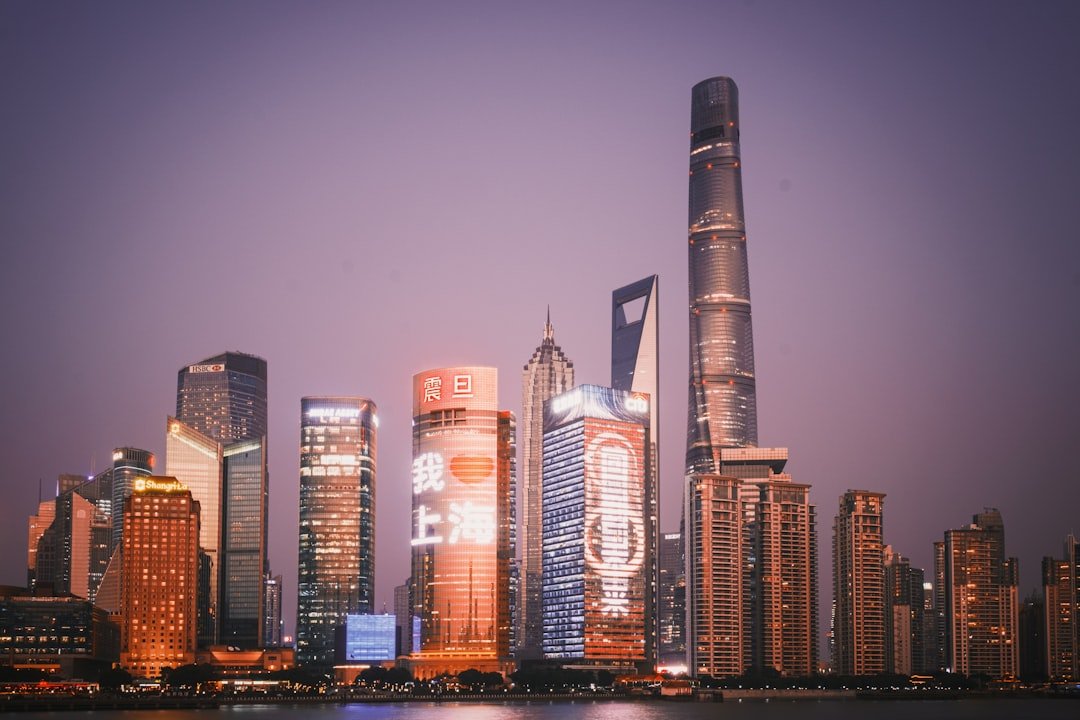 a city skyline with skyscrapers lit up at night
