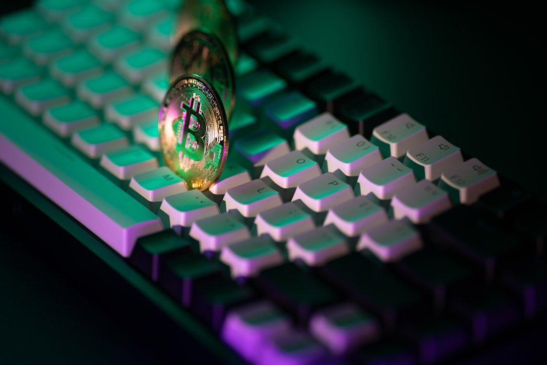 A close up of a computer keyboard with a light on it