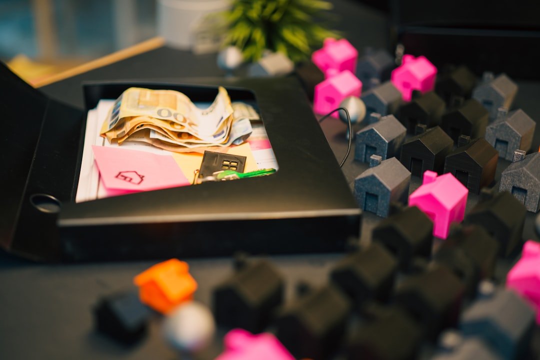 Houses and money represent a financial concept.