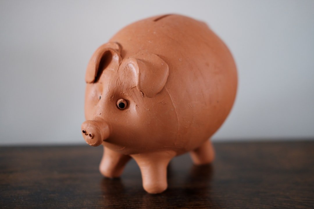 Here's a possible caption: a brown piggy bank sits on a table.