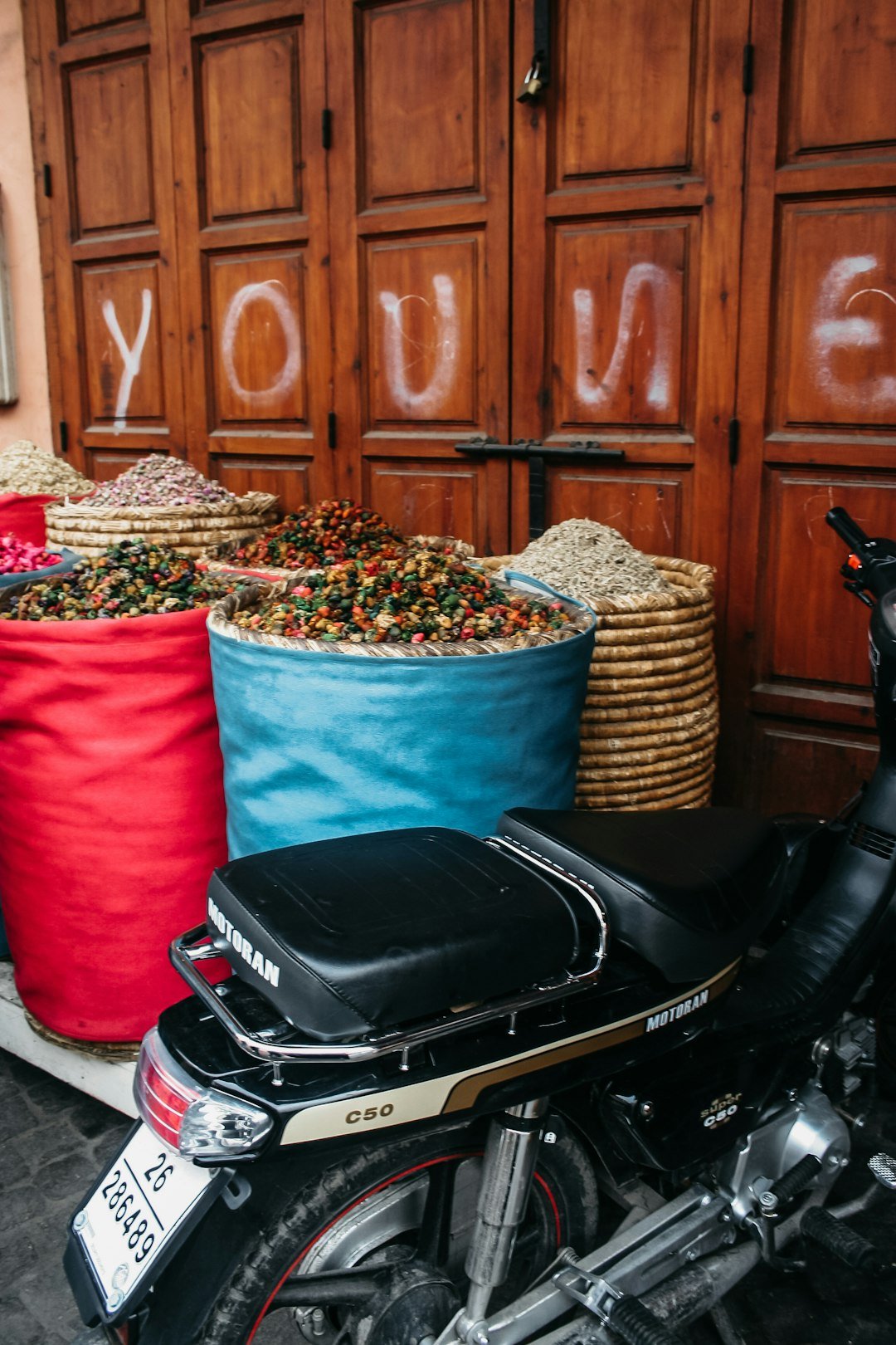 A motorcycle parked in front of a store