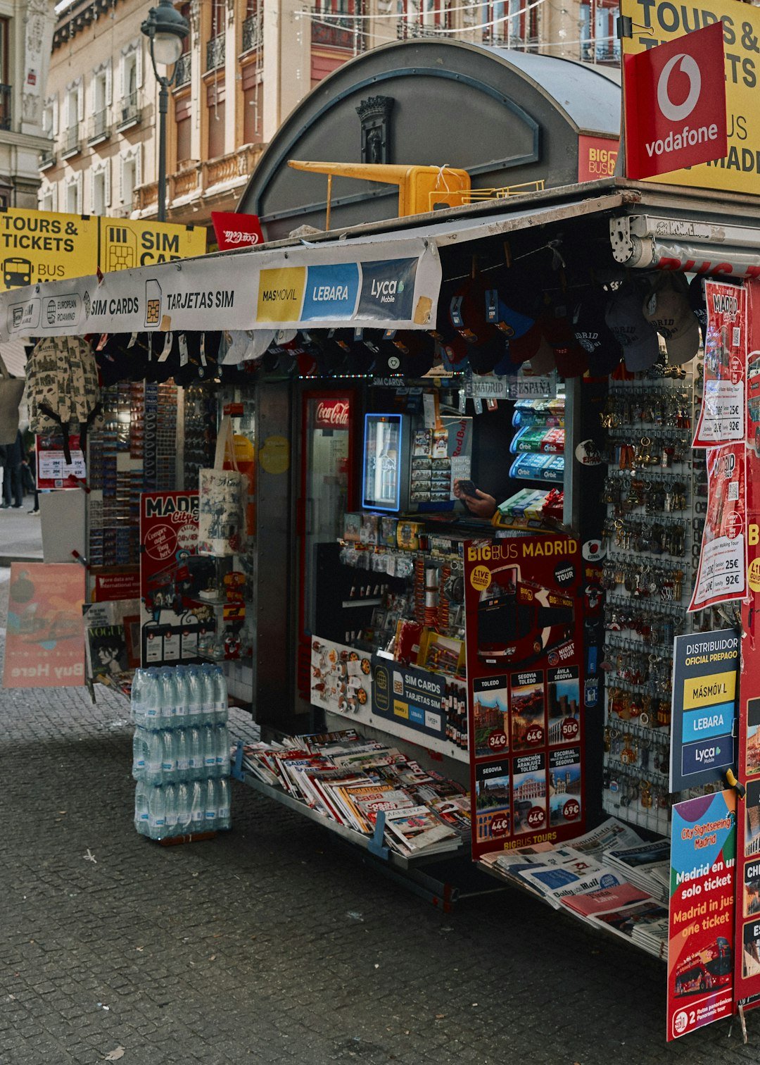 A newsstand selling newspapers, magazines, and souvenirs.