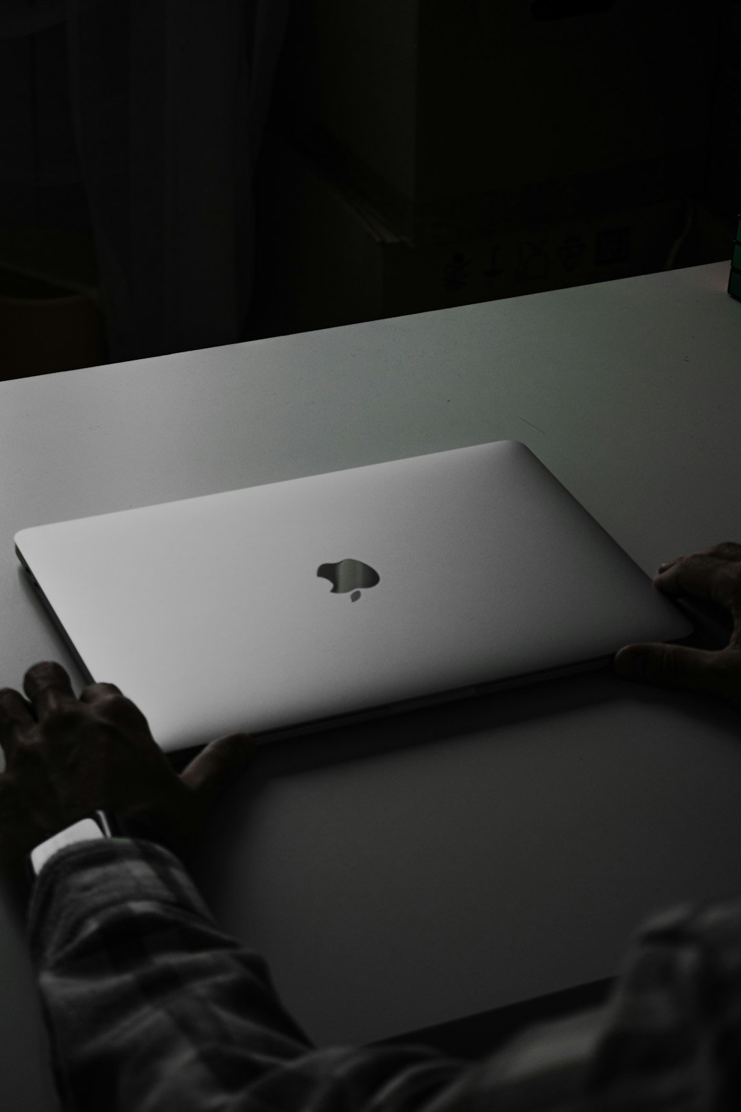 a person holding a laptop