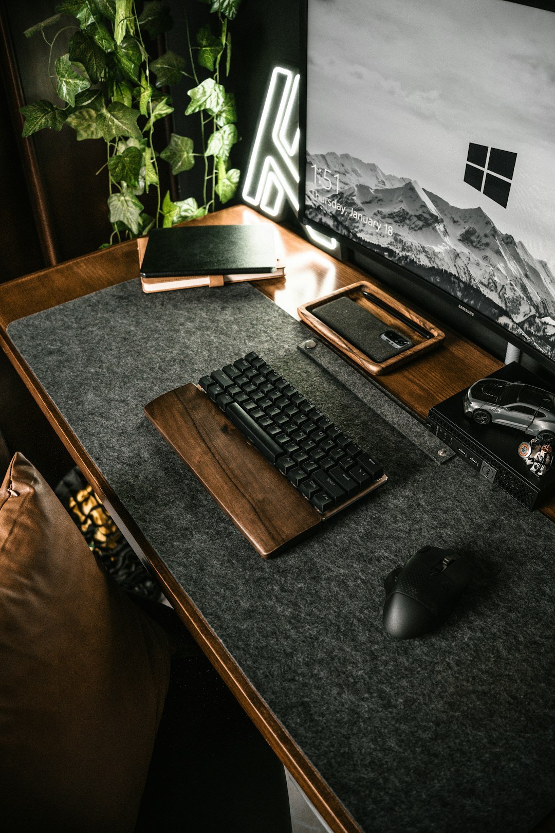 a computer desk with a keyboard and mouse