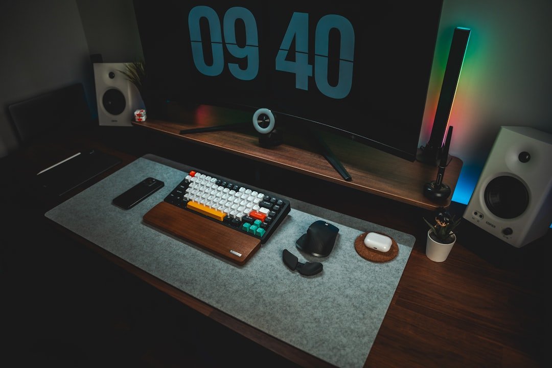 A computer monitor sitting on top of a wooden desk
