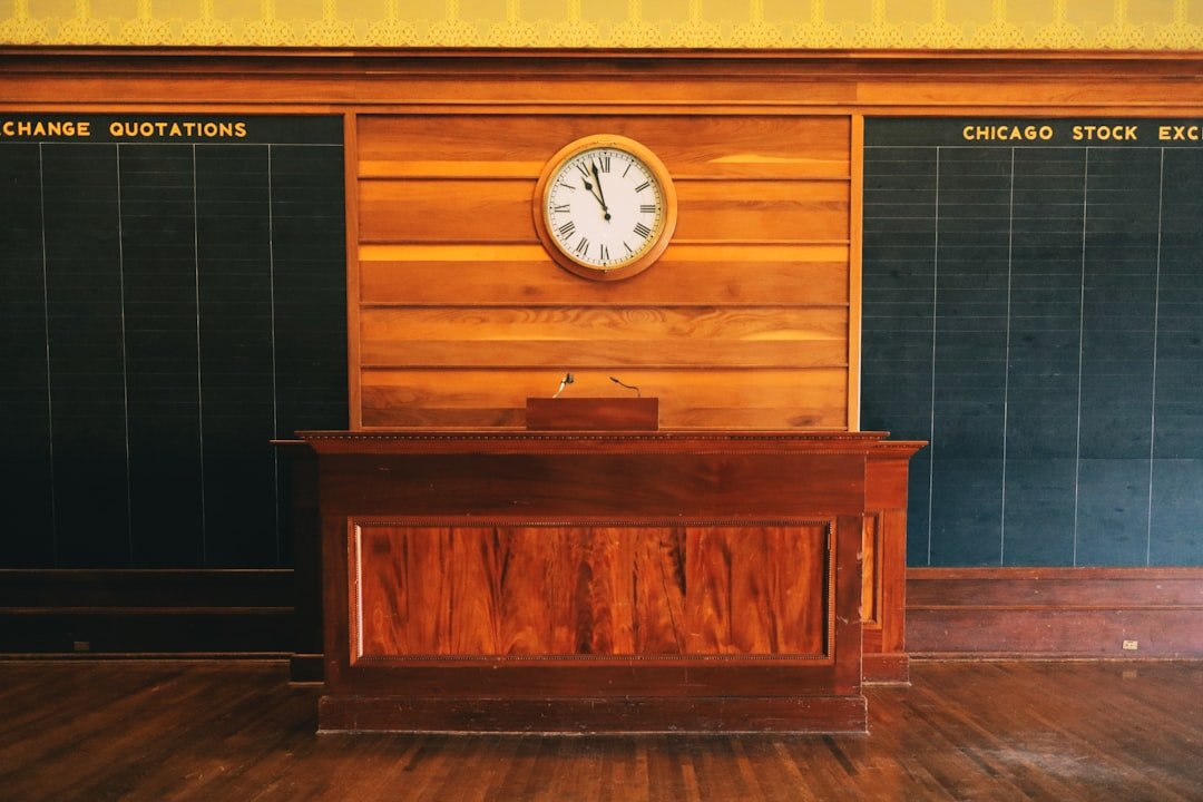An old stock exchange room with clock and quotations.