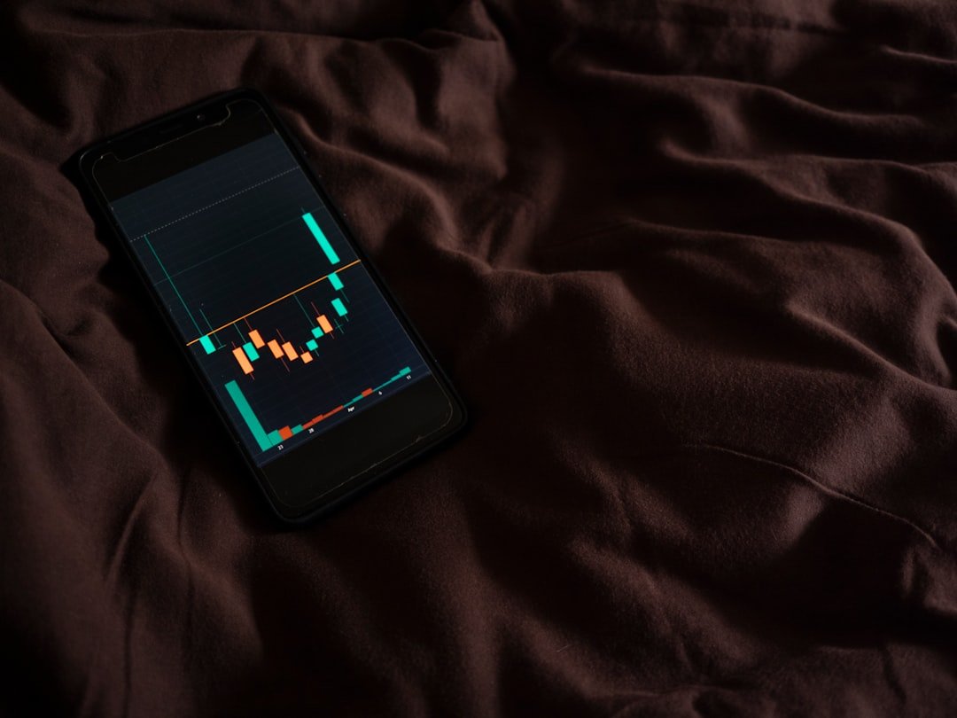 a cell phone sitting on top of a bed